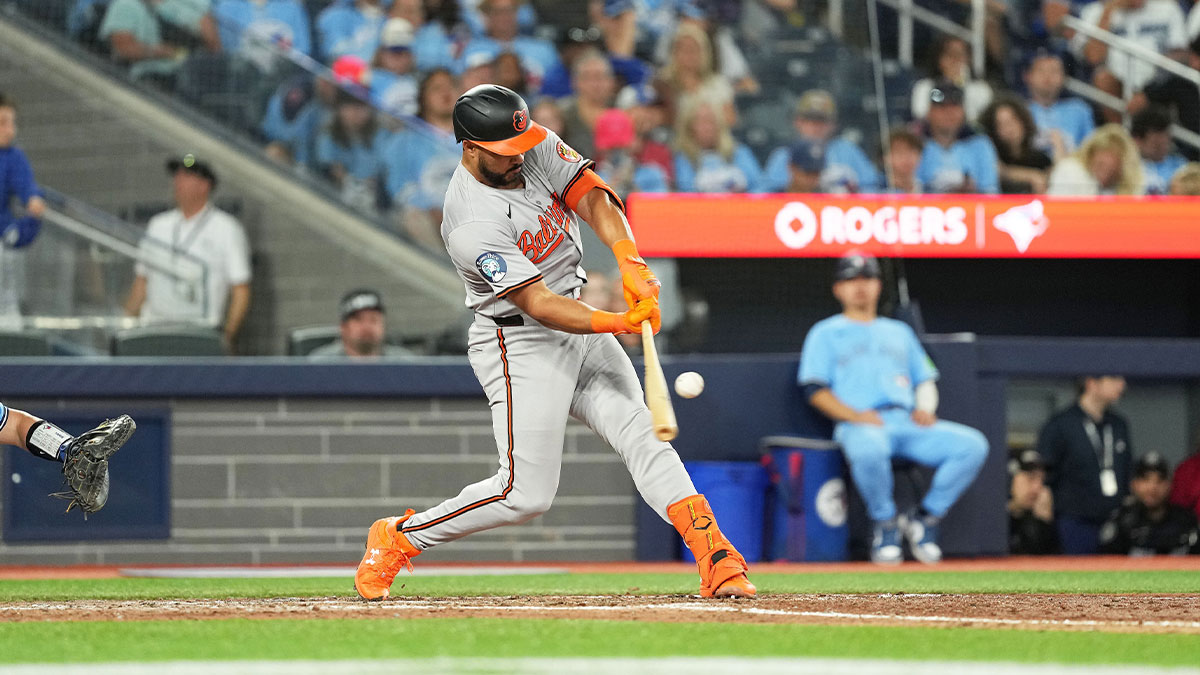 Aug 7, 2024; Toronto, Ontario, CAN; Baltimore Orioles right fielder Anthony Santander (25) hits a home run against the Toronto Blue Jays during the eighth inning at Rogers Centre. 