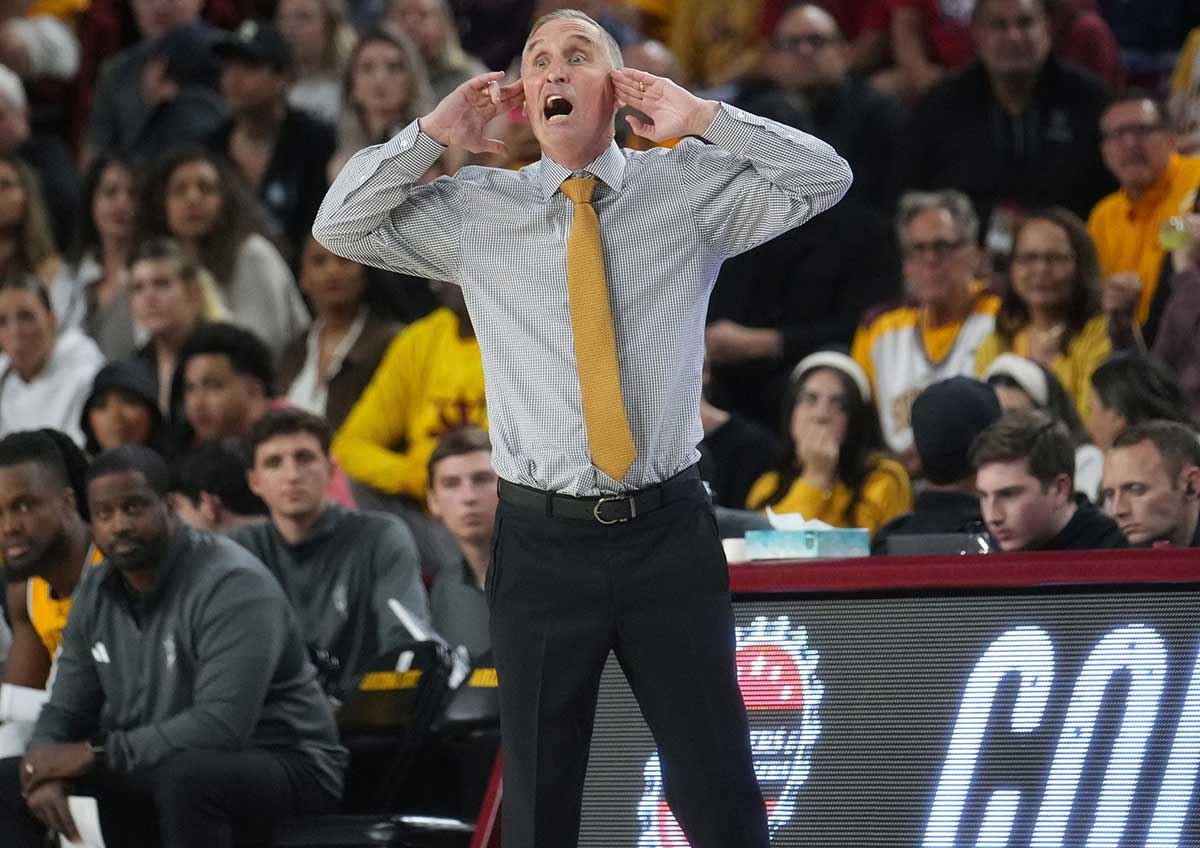 ASU Sun Devils head coach Bobby Hurley yells out to his team as they play the UA Wildcats at Desert Financial Arena in Tempe on Feb. 28, 2024.
