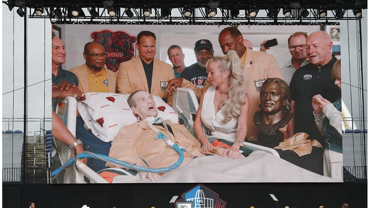 A video is played of Steve McMichael during his induction into the Pro Football Hall of Fame at the enshrinement ceremony at Tom Benson Hall of Fame Stadium. McMichael was unable to attend in person. 
