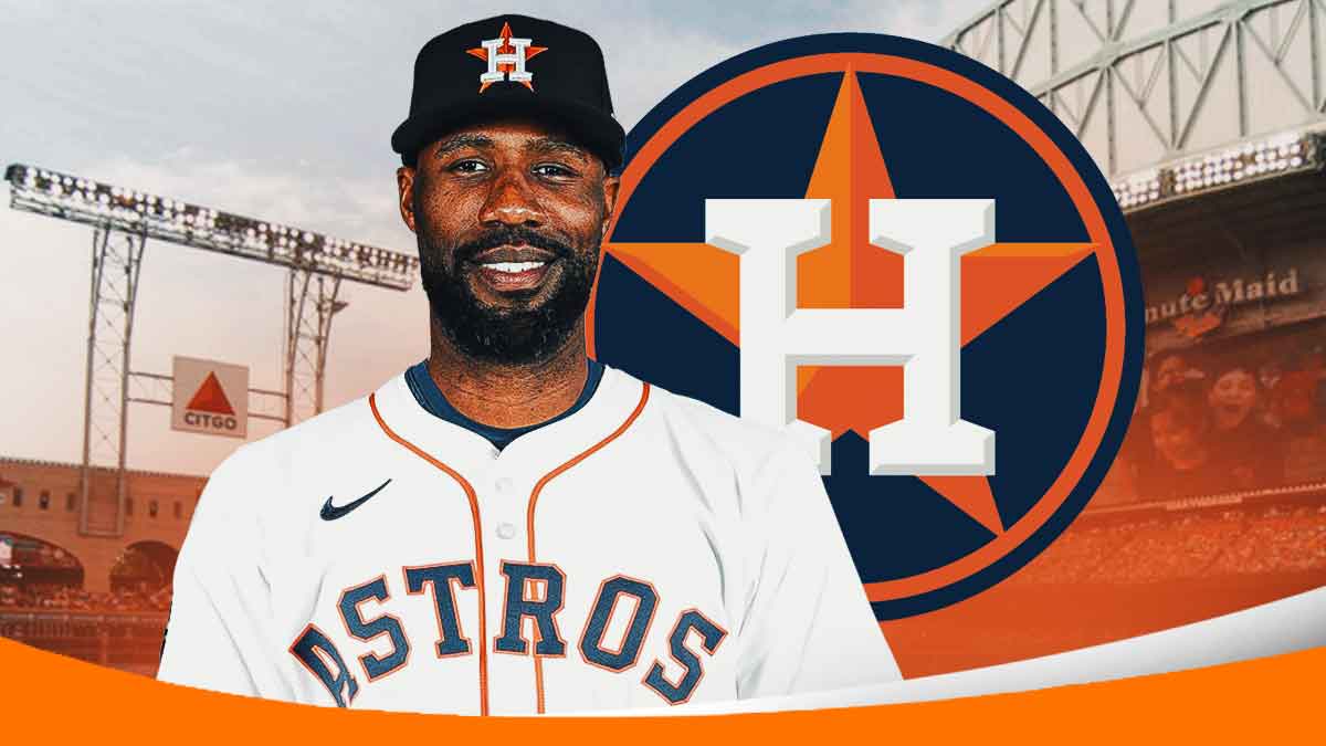 Jason Heyward in Astros gear smiles next to Astros logo