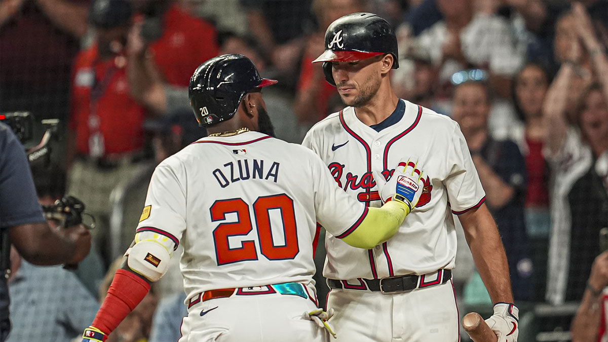Atlanta Braves designated hitter Marcell Ozuna (20) reacts with first baseman Matt Olson (28) after hitting a home run against the Philadelphia Phillies during the sixth inning at Truist Park.