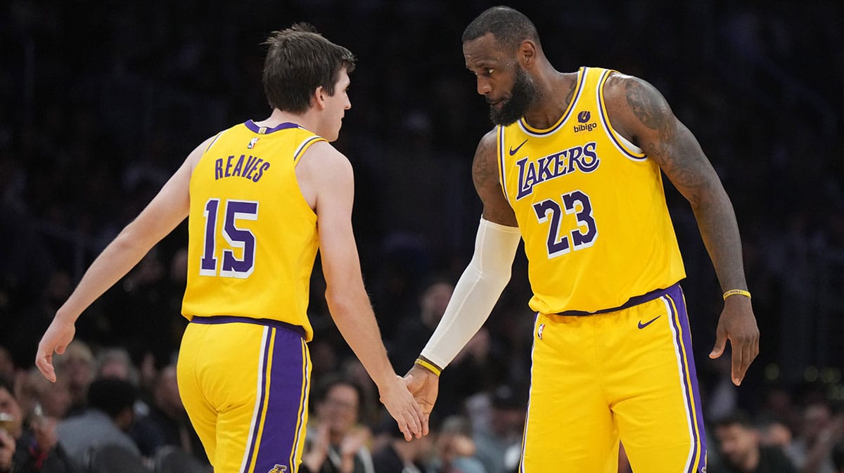  Los Angeles Lakers forward LeBron James (23) congratulates guard Austin Reaves (15) in the second half against the Dallas Mavericks at Crypto.com Arena.