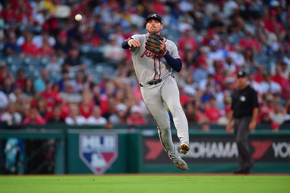 Atlanta Braves third baseman Austin Riley (27) throws to first for the out against Los Angeles Angels shortstop Zach Neto (9) during the third inning at Angel Stadium. 