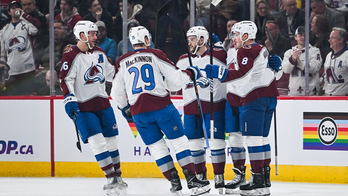 Colorado Avalanche center Ross Colton (20) celebrates his goal against the Montreal Canadiens with his teammates on the ice during the first period at Bell Centre.