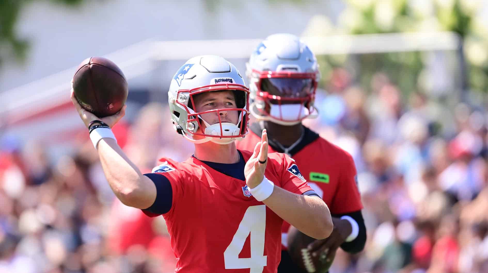 New England Patriots quarterback Bailey Zappe (4) throws a pass during training camp at Gillette Stadium. 