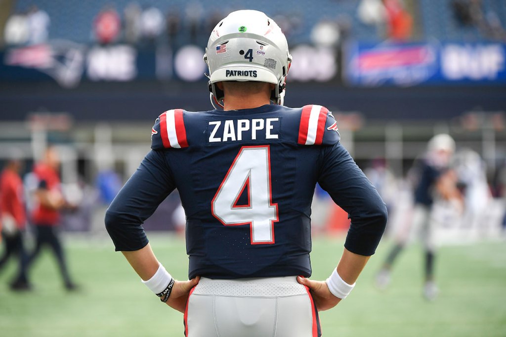 New England Patriots quarterback Bailey Zappe (4) during warm ups before a game against the Buffalo Bills at Gillette Stadium.