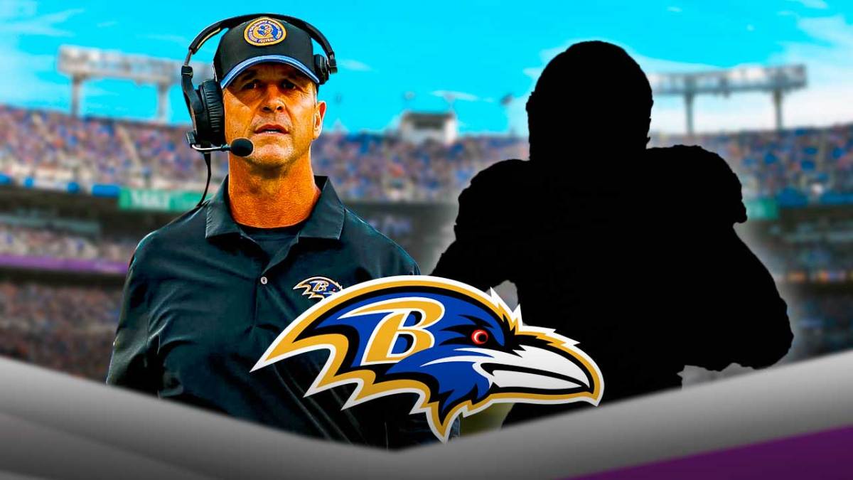 Ravens head coach John Harbaugh standing next to blacked out silhouette with the Ravens logo