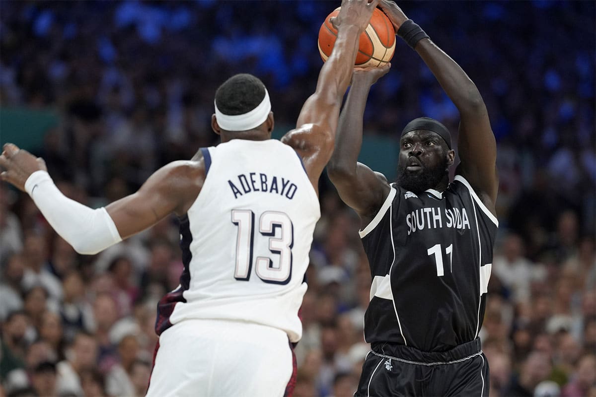 South Sudan point guard Marial Shayok (11) shoots against United States center Bam Adebayo (13) in the second quarter during the Paris 2024 Olympic Summer Games at Stade Pierre-Mauroy. 