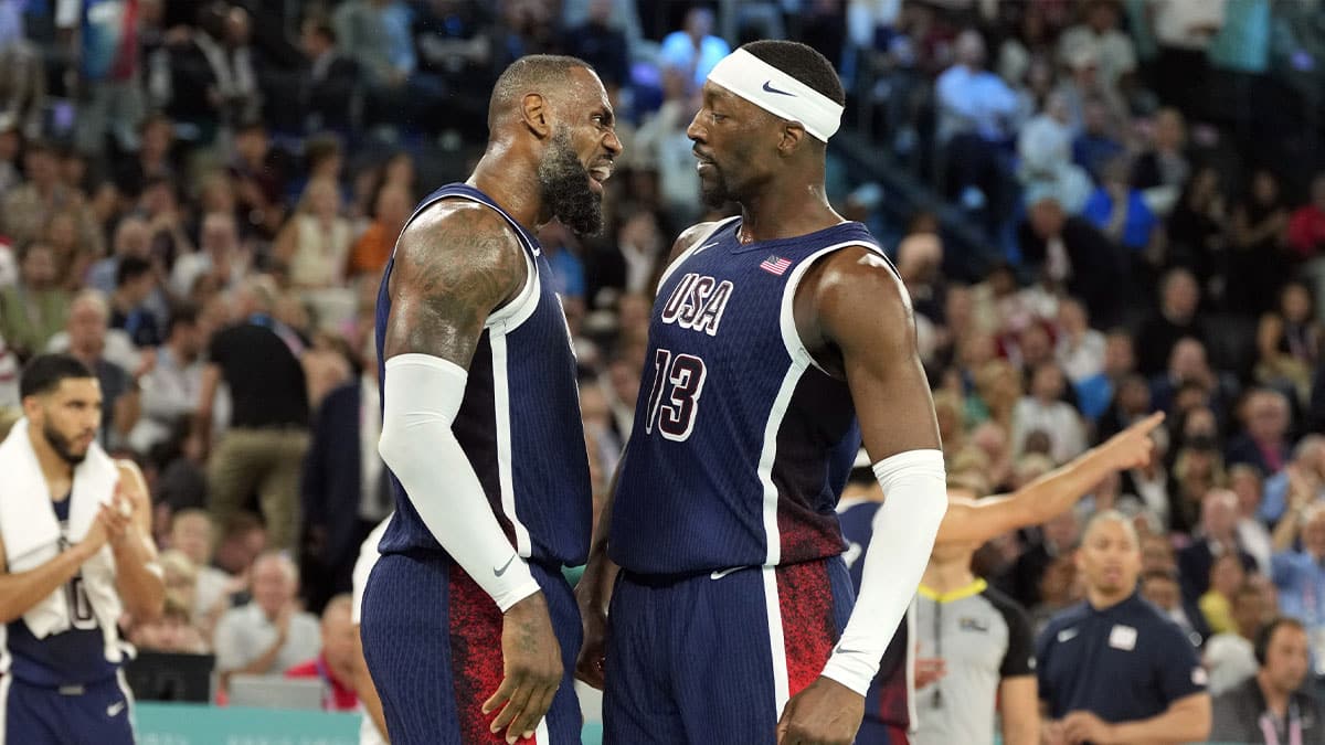 United States guard LeBron James (6) and centre Bam Adebayo (13) react in the first half against France in the men's basketball gold medal game during the Paris 2024 Olympic Summer Games at Accor Arena.