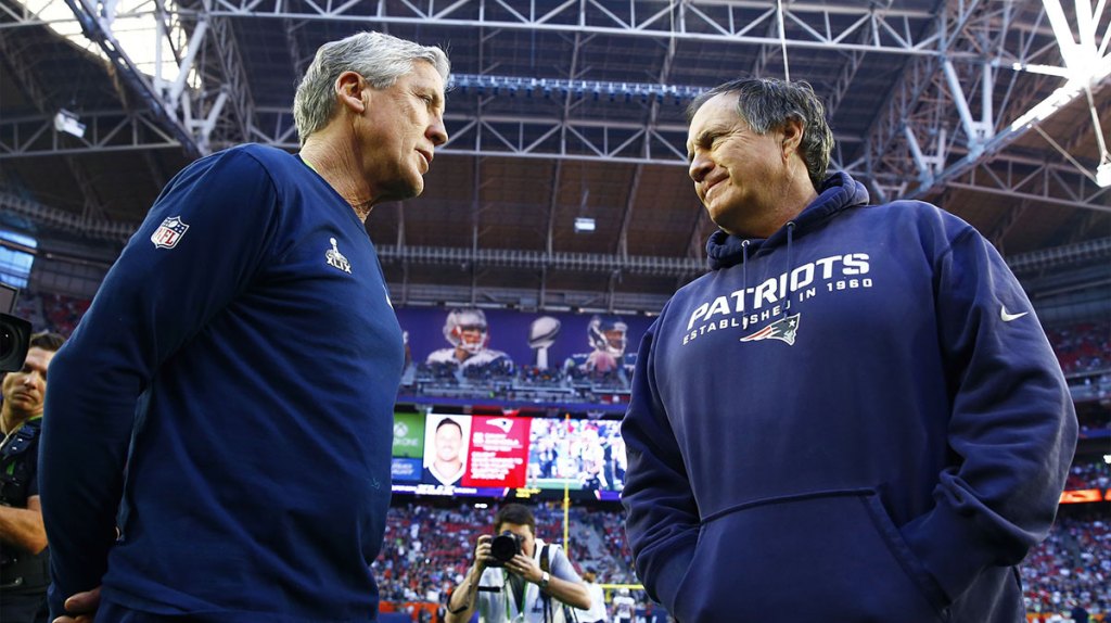 Seattle Seahawks head coach Pete Carroll (left) greets New England Patriots head coach Bill Belichick before Super Bowl XLIX at University of Phoenix Stadium.