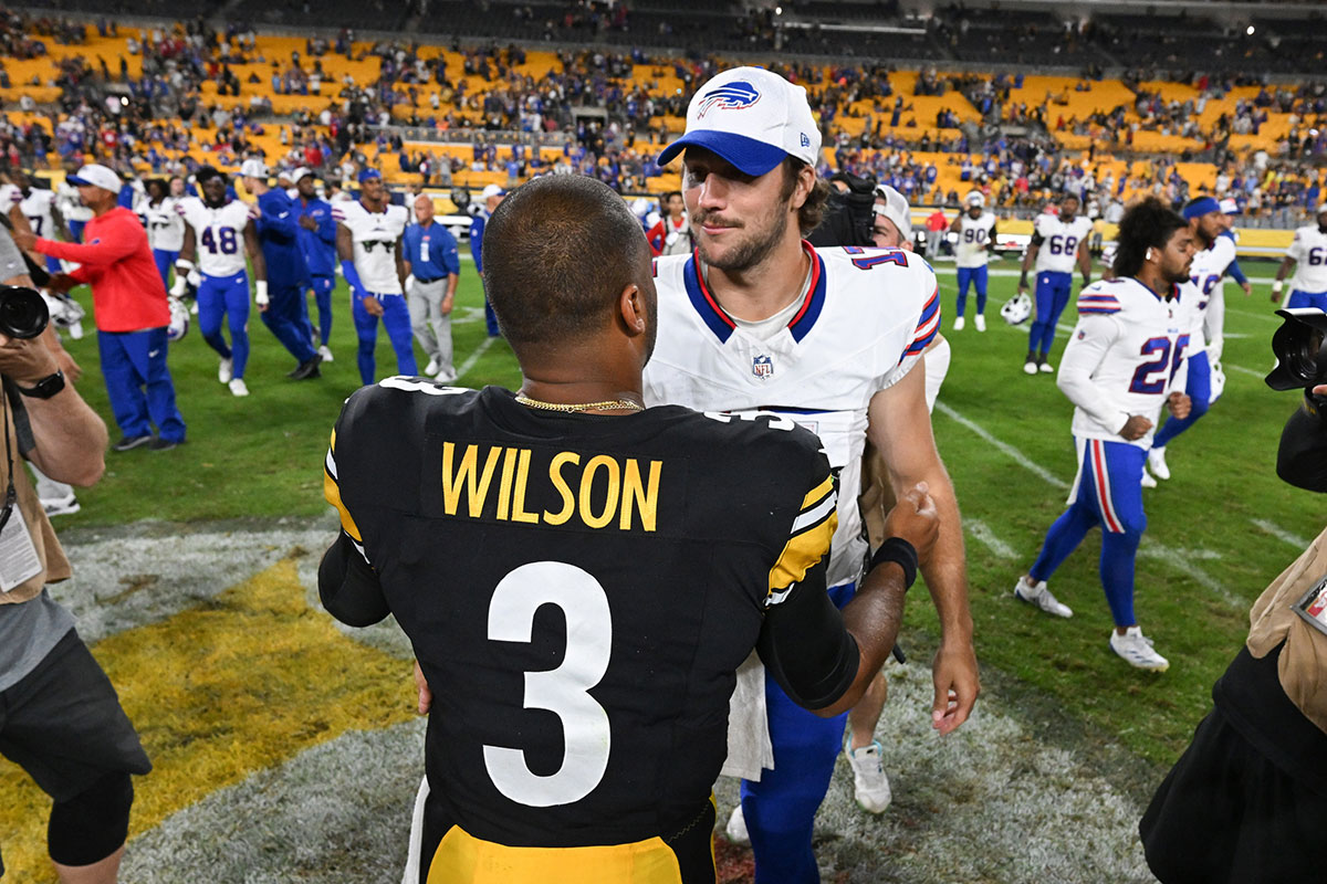 Steelers quarterback Russell Wilson (3) greets Buffalo Bills quarterback Josh Allen following their game at Acrisure Stadium.