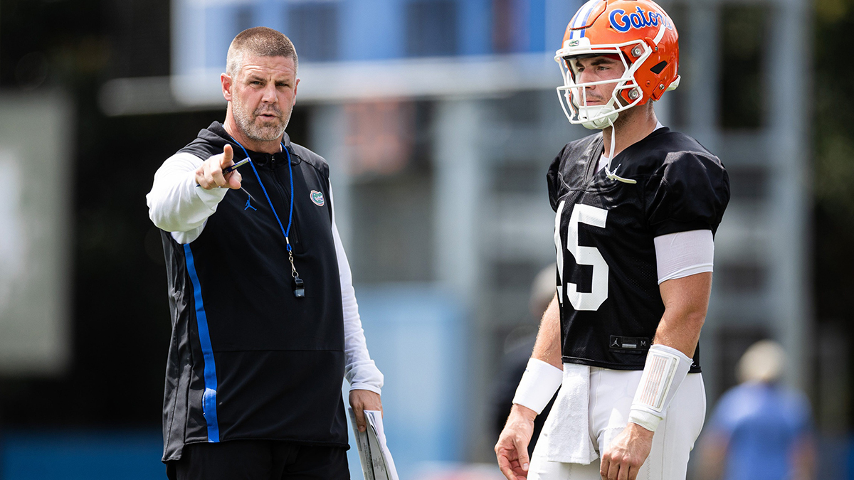 Florida Gators head coach Billy Napier talks with Florida Gators quarterback Graham Mertz (15) during fall football practice at Heavener Football Complex at the University of Florida in Gainesville, FL on Thursday, August 1, 2024. [Matt Pendleton/Gainesville Sun]