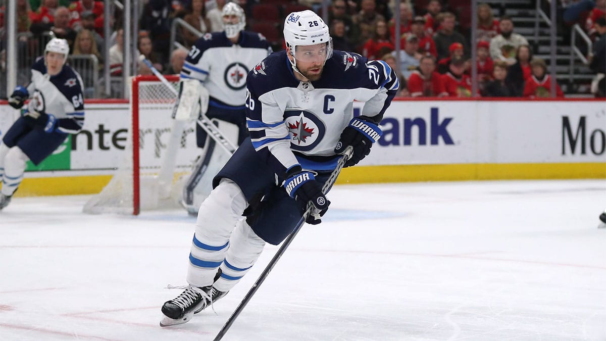 Winnipeg Jets right wing Blake Wheeler (26) skates with the puck during the first period against the Chicago Blackhawks at the United Center. 