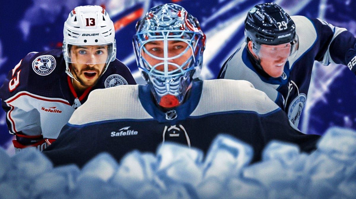 Elvis Merzlikins in middle, Johnny Gaudreau and Patrik Laine on either side, Columbus Blue Jackets logo, hockey rink in background