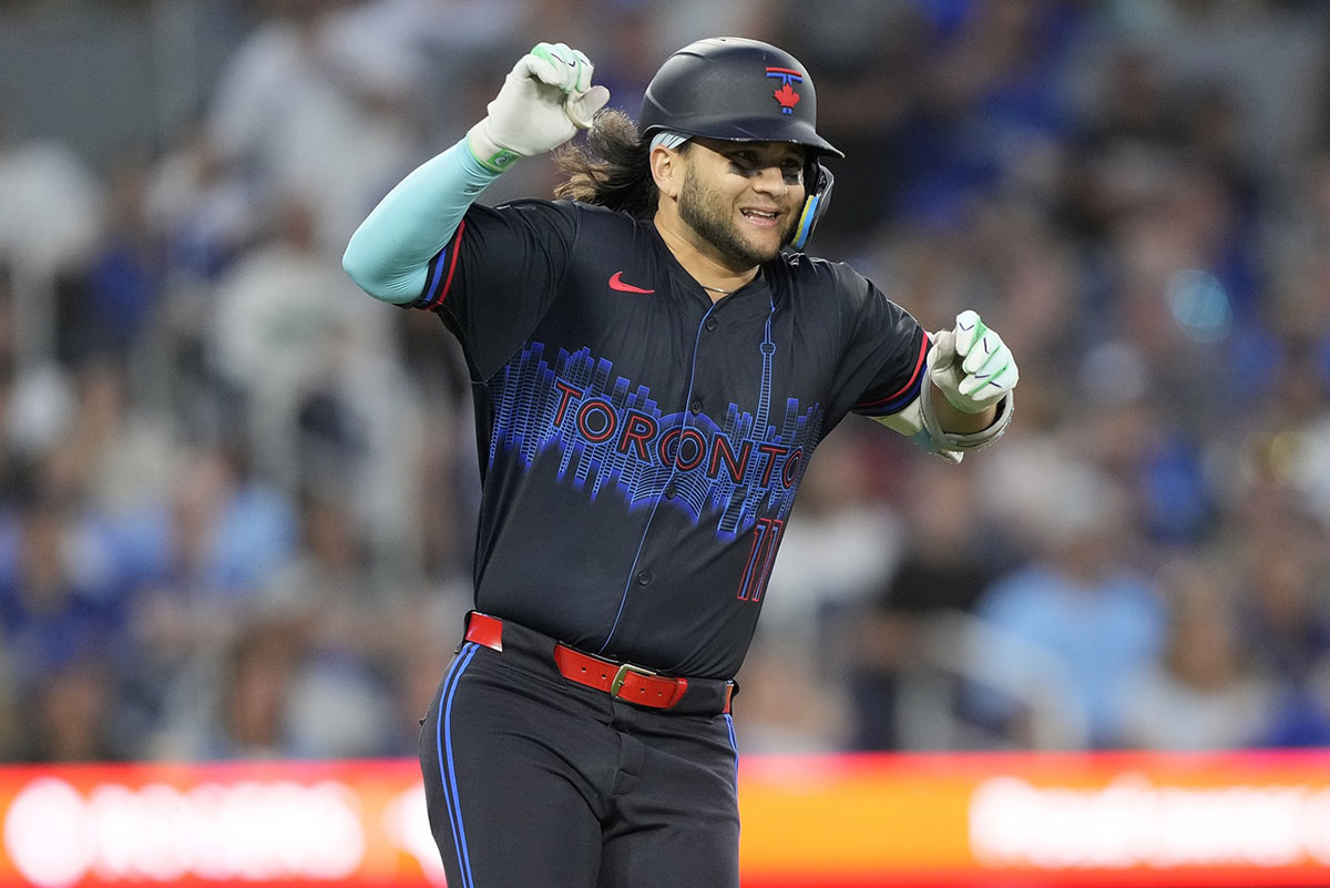 Toronto Blue Jays shortstop Bo Bichette (11) reacts as he suffers a lower body injury as he runs to first base during the sixth inning against the Detroit Tigers at Rogers Centre.
