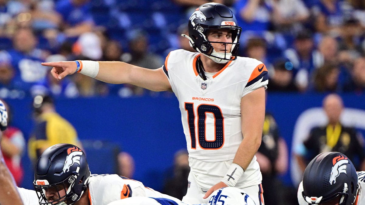 Denver Broncos quarterback Bo Nix (10) points during the second quarter against the Indianapolis Colts at Lucas Oil Stadium.