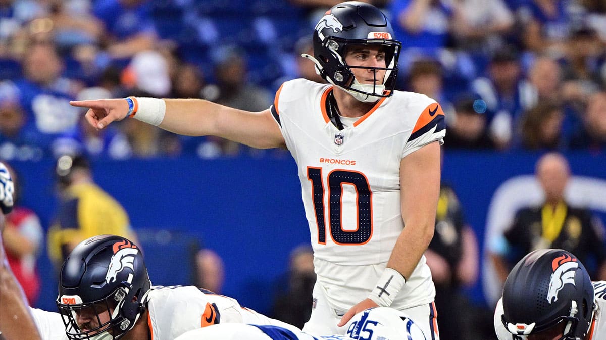  Denver Broncos quarterback Bo Nix (10) points during the second quarter against the Indianapolis Colts at Lucas Oil Stadium.