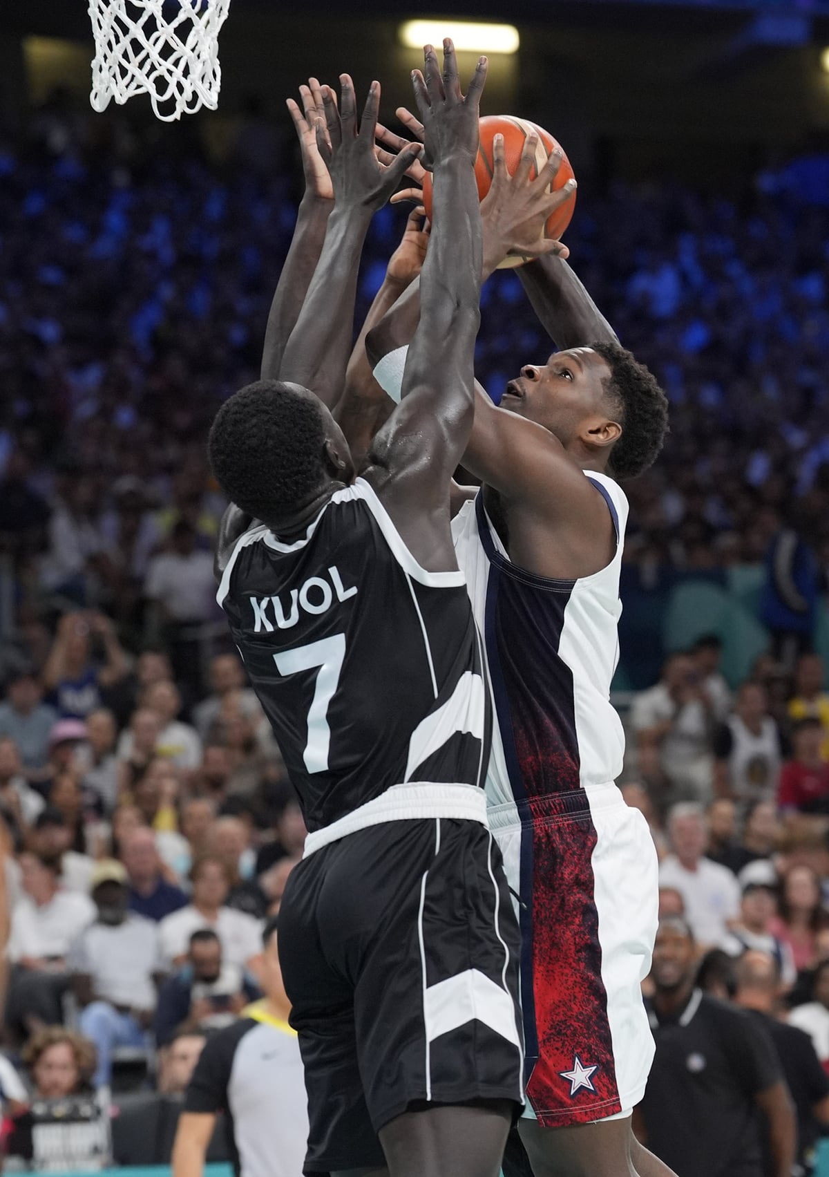 United States guard Anthony Edwards (5) shoots against South Sudan shooting guard Bul Kuol (7) in the fourth quarter during the Paris 2024 Olympic Summer Games at Stade Pierre-Mauroy.