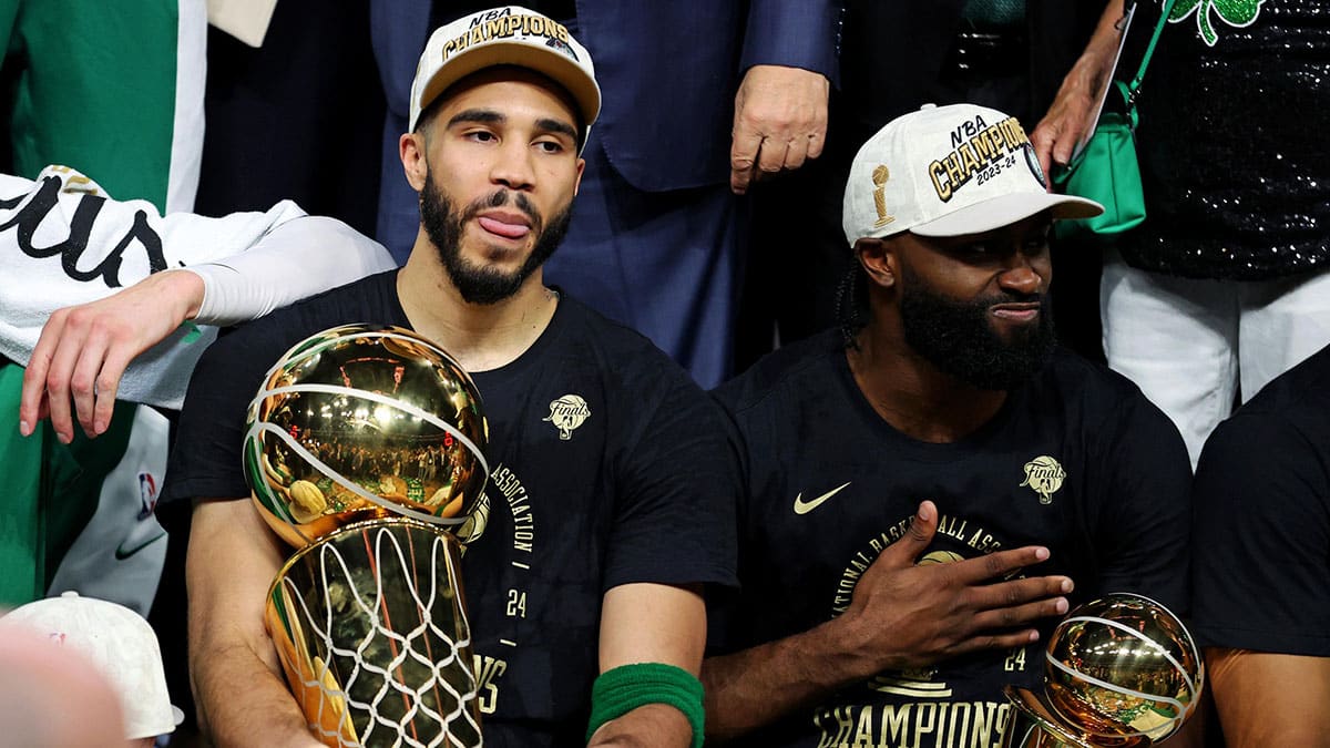 Jun 17, 2024; Boston, Massachusetts, USA; Boston Celtics forward Jayson Tatum (0) and guard Jaylen Brown (7) celebrates with the Larry O’Brian Trophy after beating the Dallas Mavericks in game five of the 2024 NBA Finals to win the NBA Championship at TD Garden. Mandatory Credit: Peter Casey-USA TODAY Sports