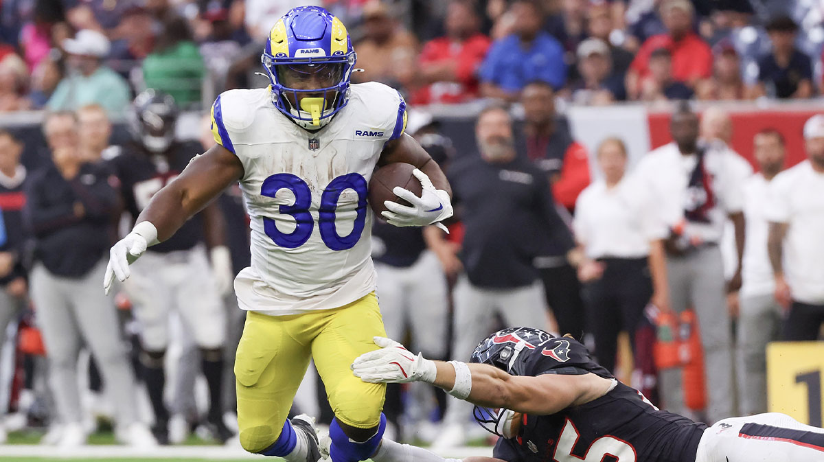 Los Angeles Rams running back Boston Scott (30) breaks the tackle of Houston Texans linebacker Max Tooley (45) in the fourth quarter at NRG Stadium.