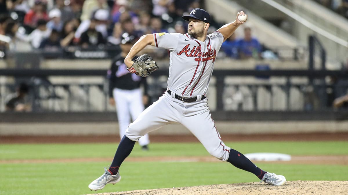 Aug 11, 2023; New York City, New York, USA; Atlanta Braves relief pitcher Brad Hand (45) pitches in the seventh inning against the New York Mets at Citi Field. 