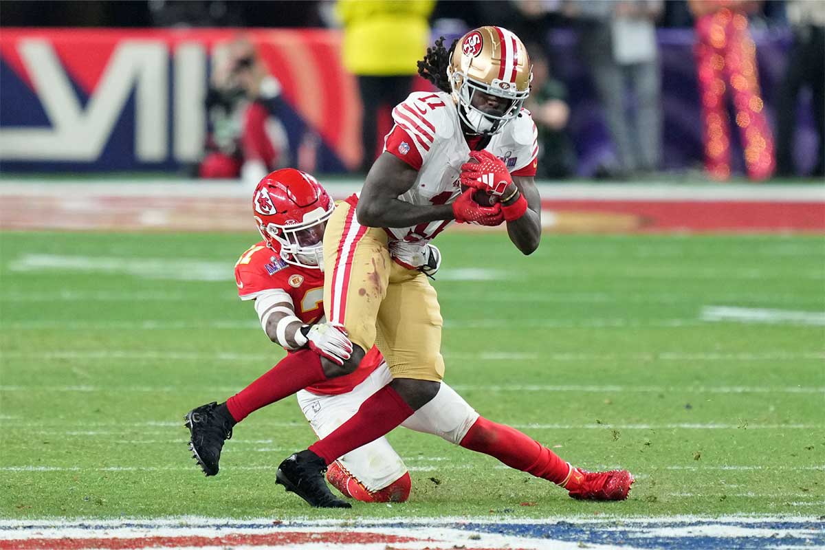 Kansas City Chiefs safety Mike Edwards (21) tackles San Francisco 49ers wide receiver Brandon Aiyuk (11) during overtime of Super Bowl LVIII at Allegiant Stadium. 