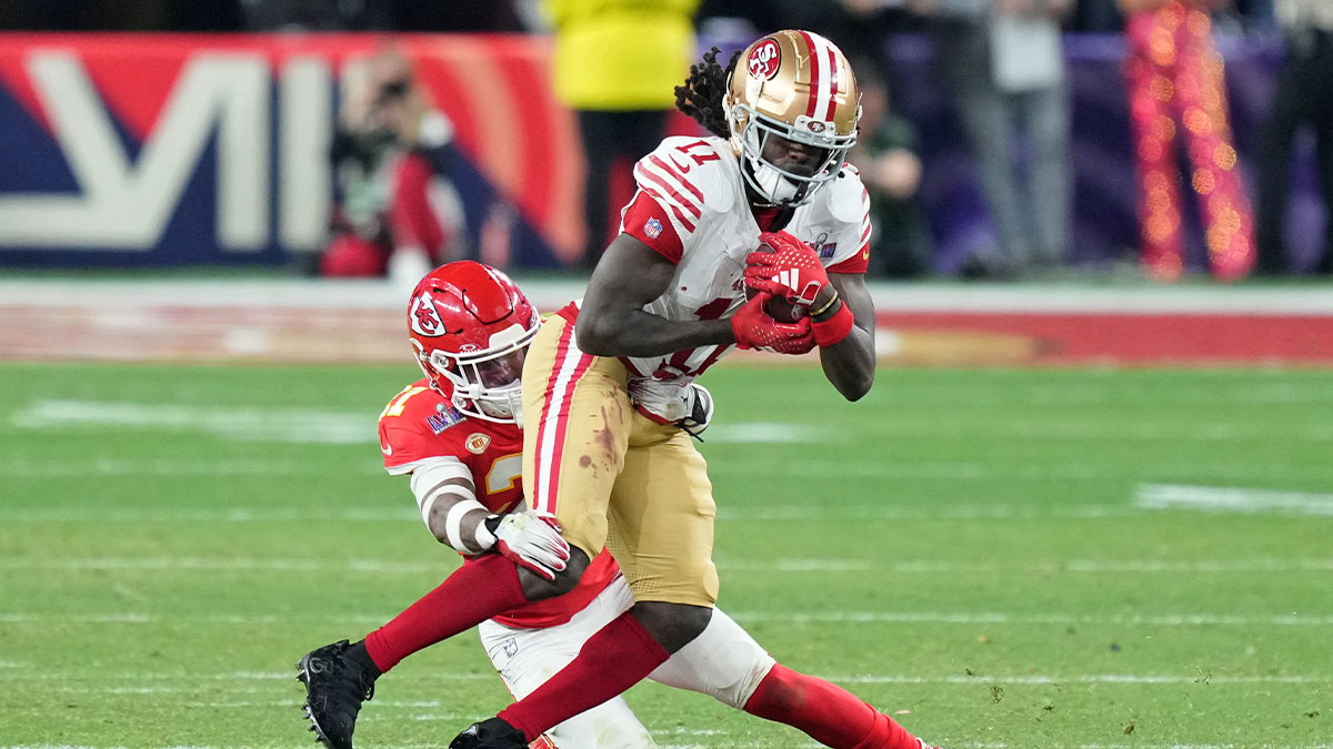 Kansas City Chiefs safety Mike Edwards (21) tackles San Francisco 49ers wide receiver Brandon Aiyuk (11) during overtime of Super Bowl LVIII at Allegiant Stadium.