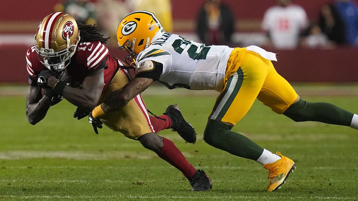 San Francisco 49ers wide receiver Brandon Aiyuk (11) makes an 11-yard reception before being tackled by Green Bay Packers cornerback Jaire Alexander (23) during the third quarter of their NFC divisional playoff game