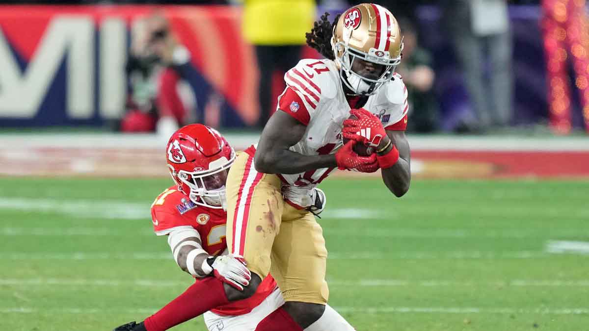 Kansas City Chiefs safety Mike Edwards (21) tackles San Francisco 49ers wide receiver Brandon Aiyuk (11) during overtime of Super Bowl LVIII at Allegiant Stadium. 