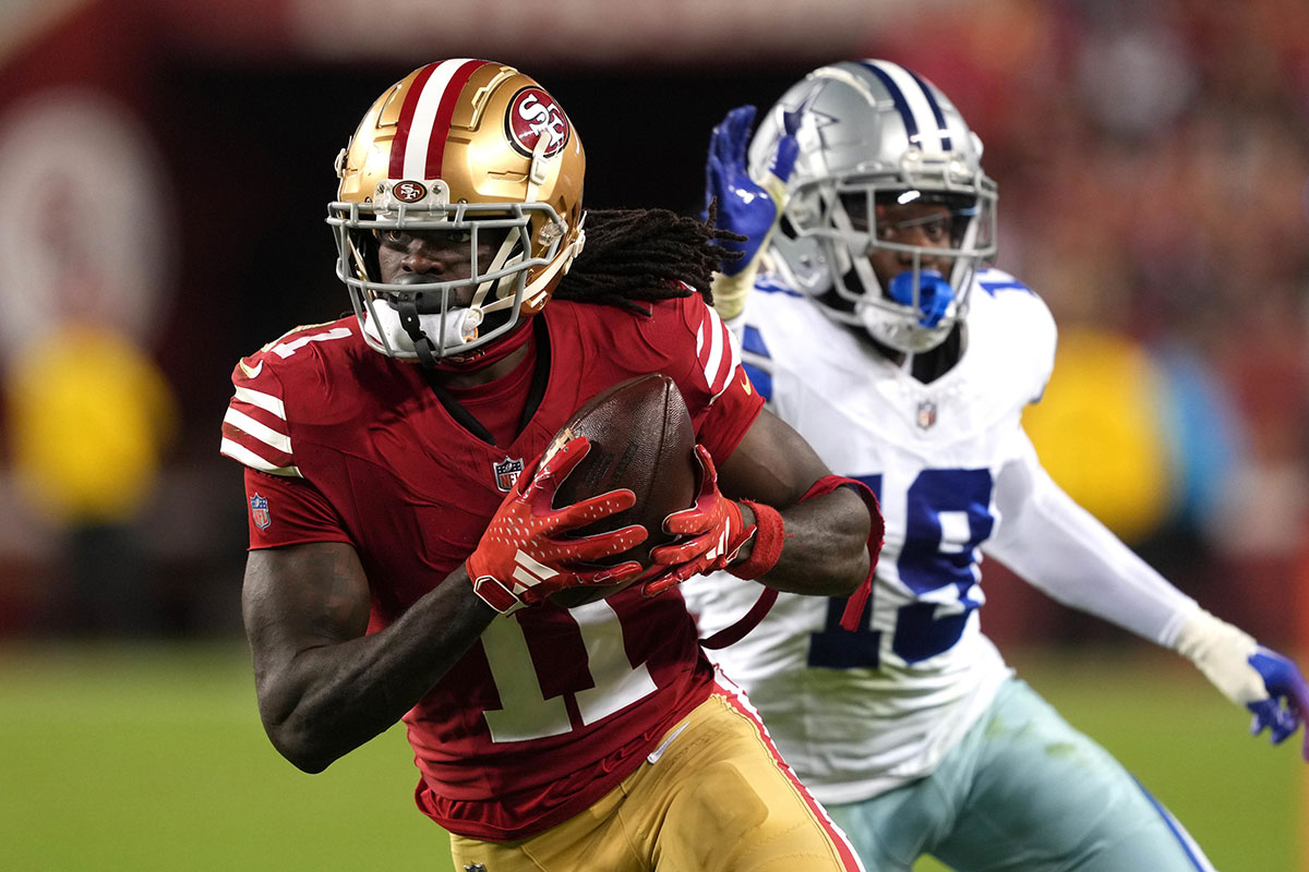 San Francisco 49ers wide receiver Brandon Aiyuk (11) runs after a catch against Dallas Cowboys cornerback Noah Igbinoghene (19) during the third quarter at Levi's Stadium.