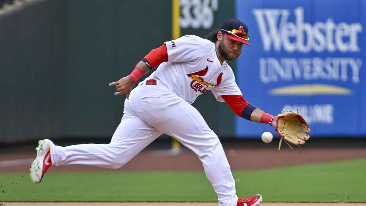 Jul 14, 2024; St. Louis, Missouri, USA; St. Louis Cardinals third baseman Brandon Crawford (35) fields a ground ball against the Chicago Cubs during the eighth inning at Busch Stadium.