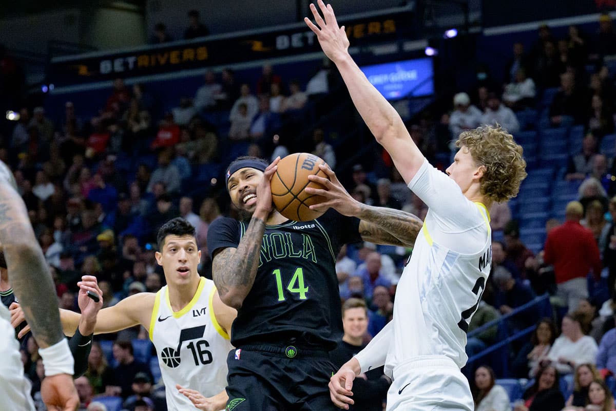 New Orleans Pelicans forward Brandon Ingram (14) runs into Utah Jazz forward Lauri Markkanen (23) during the first quarter at Smoothie King Center. 