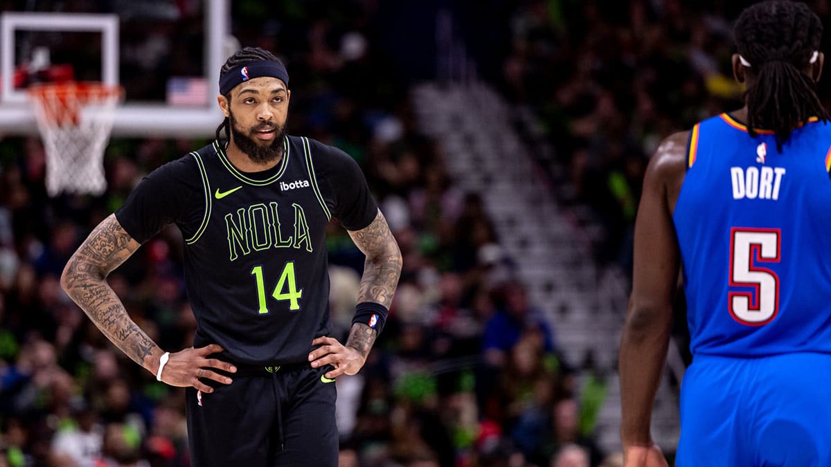 New Orleans Pelicans forward Brandon Ingram (14) looks on against Oklahoma City Thunder guard Luguentz Dort (5) during the first half of game four of the first round for the 2024 NBA playoffs at Smoothie King Center.