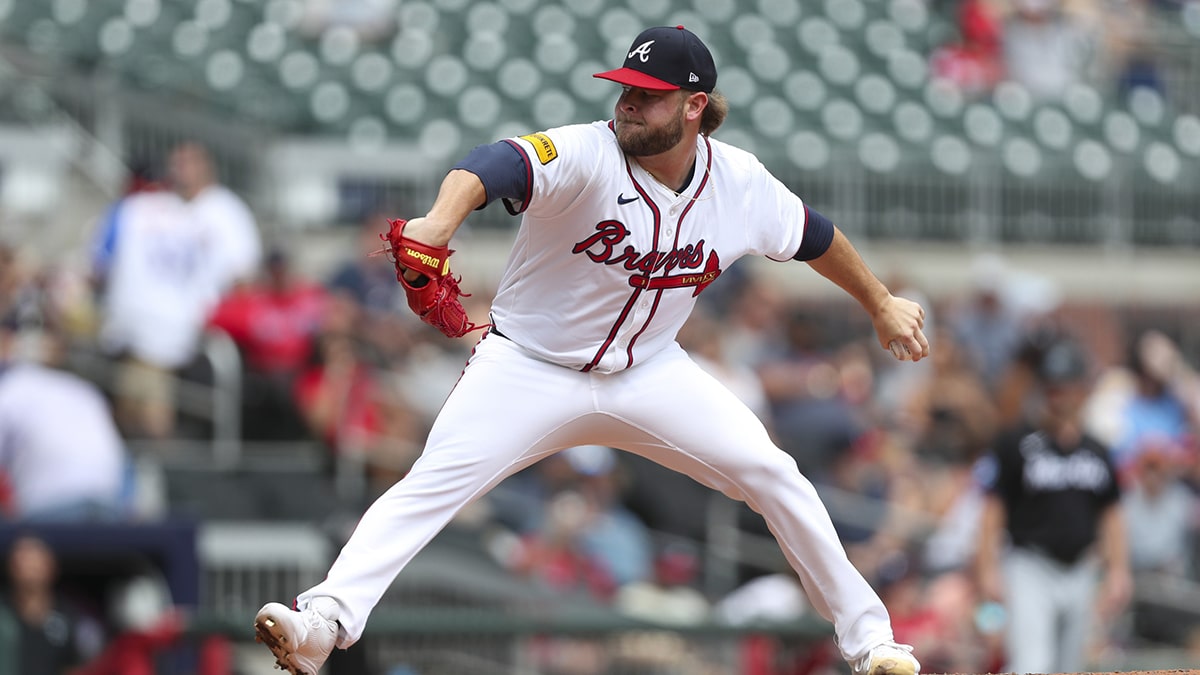  Atlanta Braves relief pitcher A.J. Minter (33) pitches during a game against the Miami Marlins in the ninth inning at Truist Park.