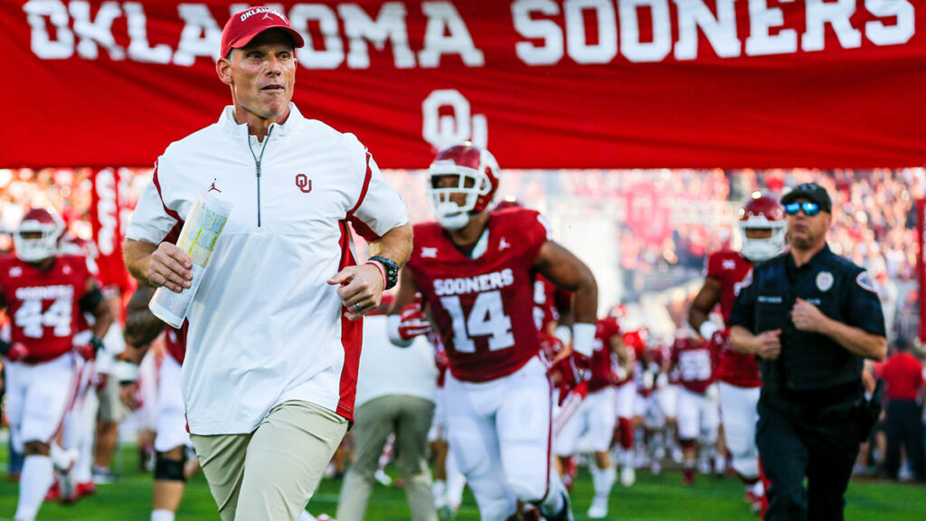 Brent Venables runs on the field before an NCAA football game between University of Oklahoma (OU) and Iowa State at the Gaylord Family Oklahoma Memorial Stadium in Norman, Okla., on Saturday, Sept. 30, 2023.