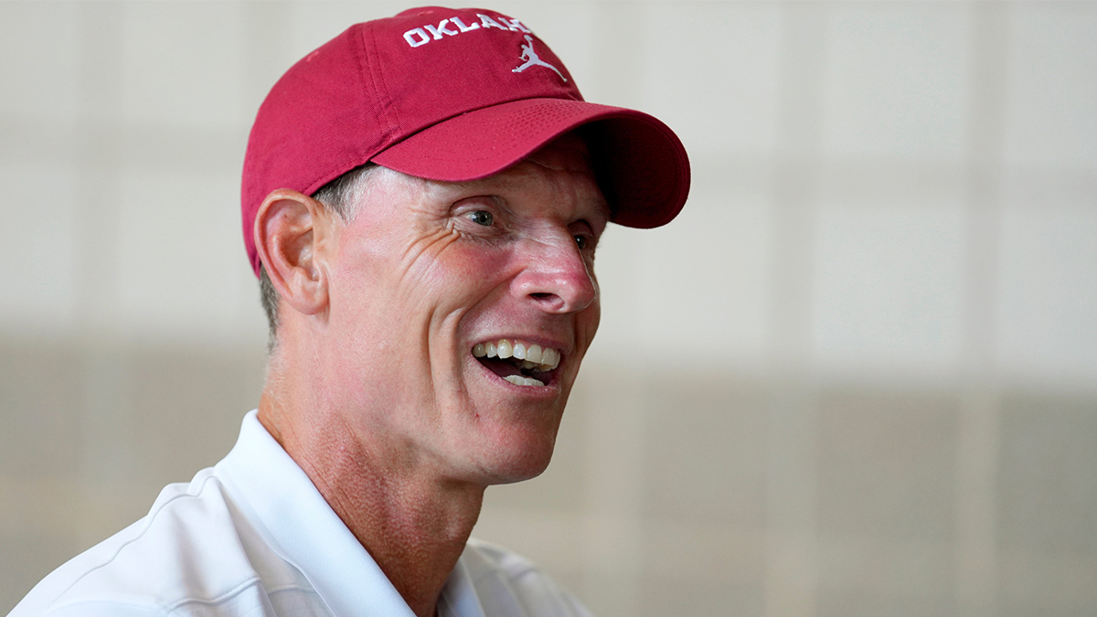 OU coach Brent Venables talks with a fan during Meet the Sooners Day for the University of Oklahoma football team at Gaylord Family-Oklahoma Memorial stadium