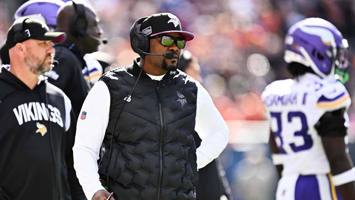 Minnesota Vikings defensive coordinator Brian Flores watches his team play against the Chicago Bears at Soldier Field.