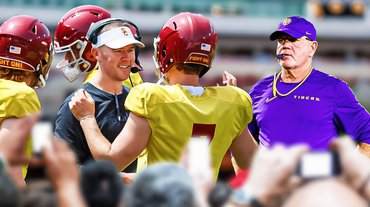 LSU football coach Brian Kelly looking at Lincoln Riley and the USC trojans team.