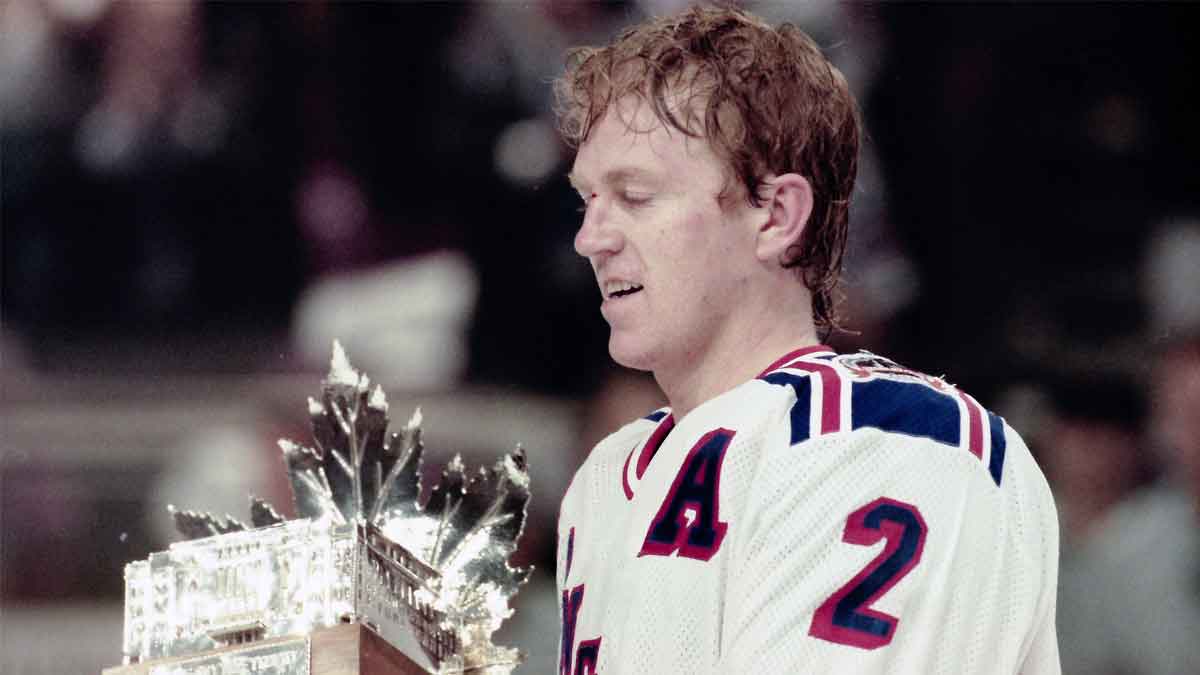 Brian Leetch of the Rangers receives the Conn Smythe Trophy as the most valuable player of the playoffs after Game 7 of the Stanley Cup Finals at Madison Square Garden on June 14, 1994. The Rangers won the game 3-2 and the Stanley Cup.