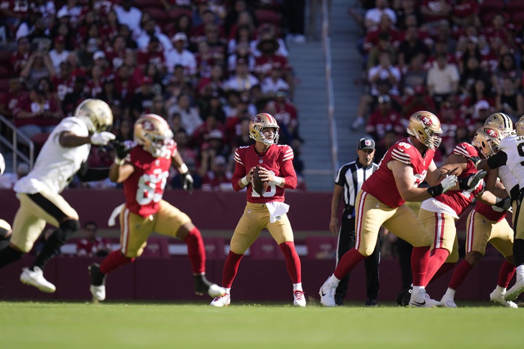 San Francisco 49ers quarterback Brock Purdy (13) passes the football against the New Orleans Saints during the first quarter at Levi's Stadium.