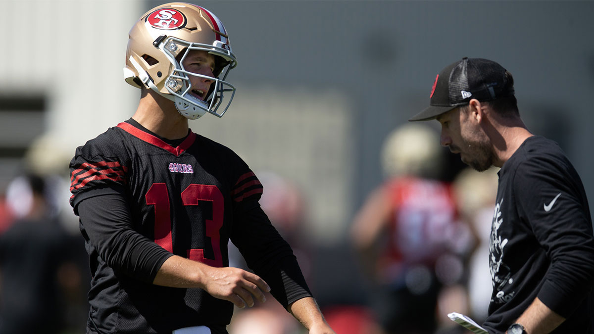 San Francisco 49ers quarterback Brock Purdy (13) talks with a coach during Day 4 of training camp at SAP Performance Facility.
