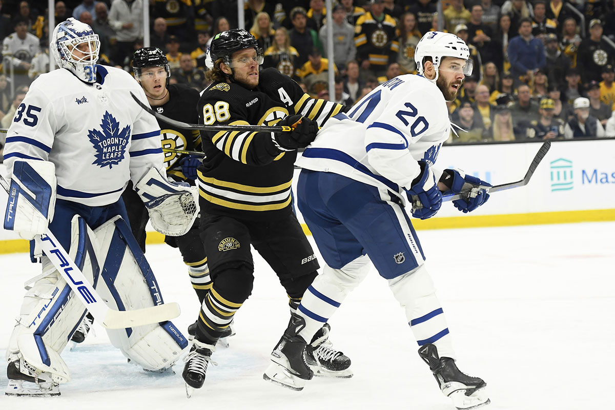 Boston Bruins right wing David Pastrnak (88) battles with Toronto Maple Leafs defenseman Joel Edmundson (20) in front of goaltender Ilya Samsonov (35) during the first period in game seven of the first round of the 2024 Stanley Cup Playoffs at TD Garden.
