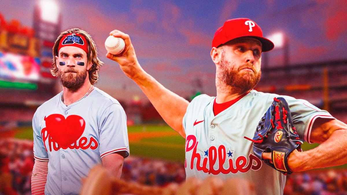 Bryce Harper in a Philadelphia Phillies uniform with a big red heart on his chest facing Zack Wheeler pitching in a Philadelphia Phillies uniform as Harper won a big game today but with a walk-off hit but credited Wheeler for his pitching as the Phillies fight for the playoffs.