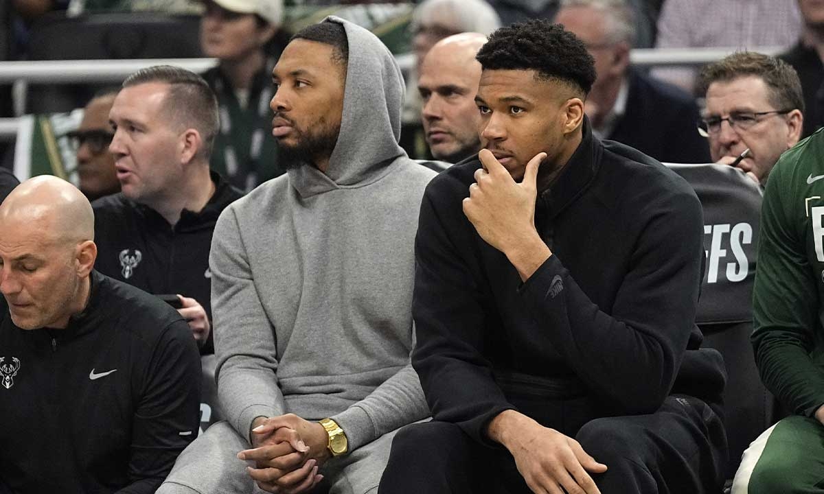 Milwaukee Bucks guard Damian Lillard and forward Giannis Antetokounmpo watch from the bench during the first quarter during game five of the first round for the 2024 NBA playoffs against the Indiana Pacers at Fiserv Forum.