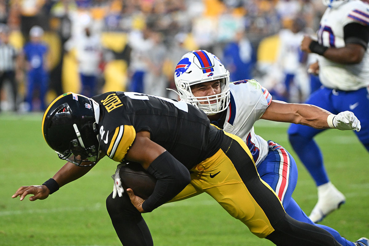 Buffalo Bills linebacker Joe Andreessen (44) tackles Pittsburgh Steelers quarterback Justin Fields (2) during the second quarter at Acrisure Stadium.