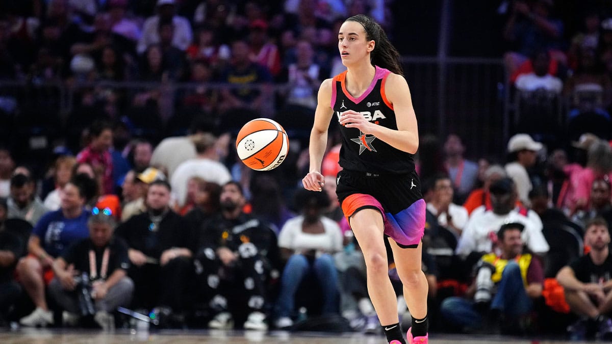 Team WNBA guard Caitlin Clark dribbles up the court against Team USA during the WNBA All-Star Game at Footprint Center in Phoenix on July 20, 2024.