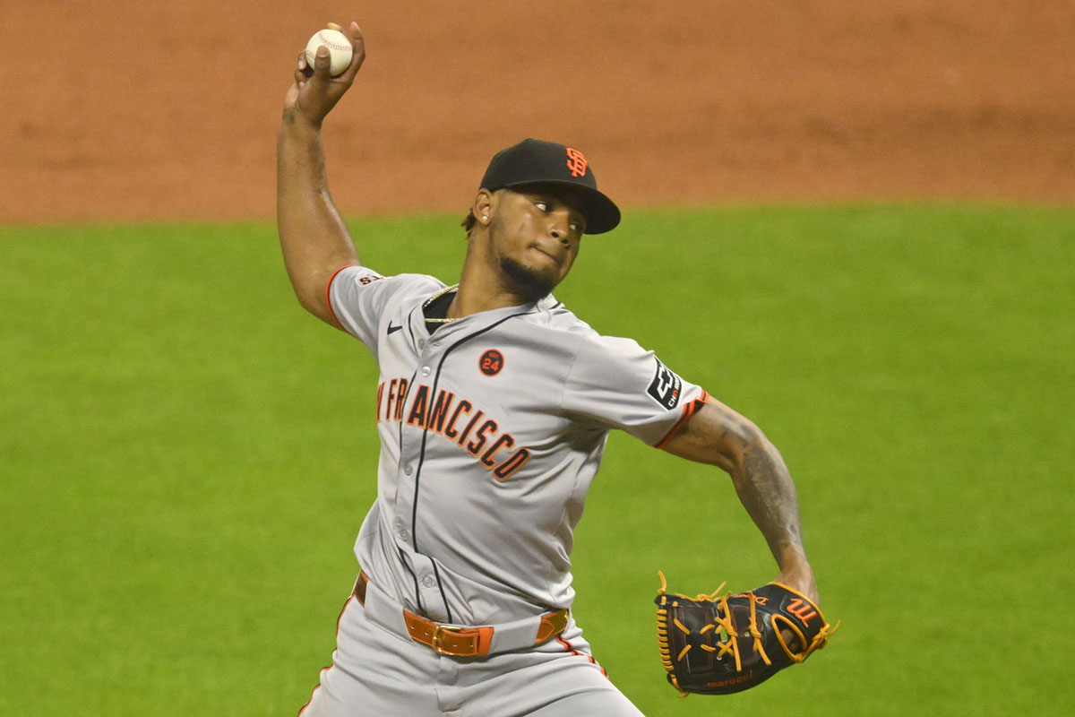 San Francisco Giants relief pitcher Camilo Doval (75) delivers a pitch in the ninth inning against the Cleveland Guardians at Progressive Field.