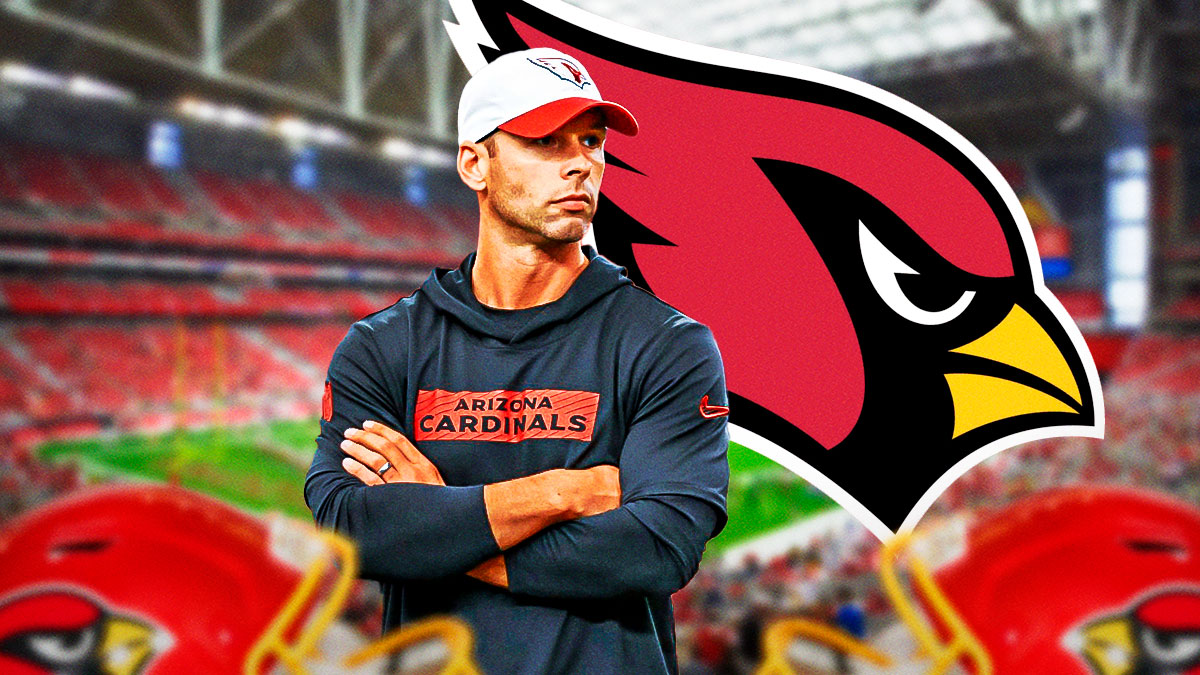 Jonathan Gannon looking upset next to a Cardinals logo at State Farm Stadium