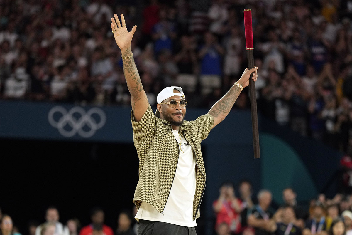Carmelo Anthony performs before a men’s basketball quarterfinal game between the United States and Brazil during the Paris 2024 Olympic Summer Games at Accor Arena.