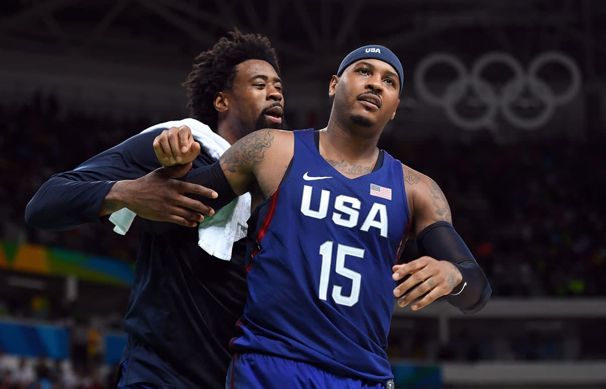 USA forward Carmelo Anthony (15) reacts with USA center DeAndre Jordan (6) against Serbia in the men's gold game during the during the Rio 2016 Summer Olympic Games at Carioca Arena 1.